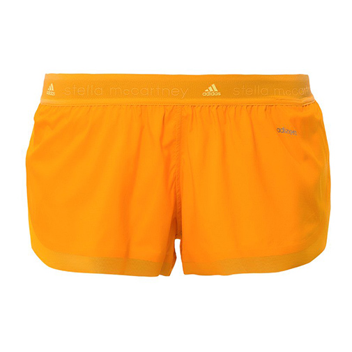 RUN - krótkie spodenki sportowe - adidas by Stella McCartney - kolor pomarańczowy